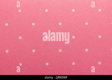 Full frame abstract texture background of solid pink and white polka dots pattern with selective focus Stock Photo