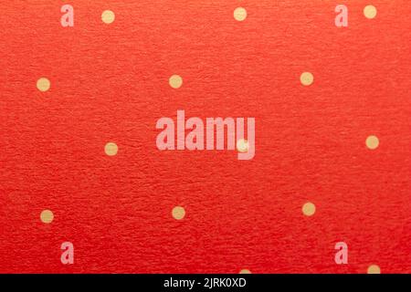 Full frame abstract texture background of solid red and yellow polka dots pattern with selective focus Stock Photo