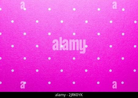Full frame abstract texture background of solid pink and white polka dots pattern with selective focus Stock Photo