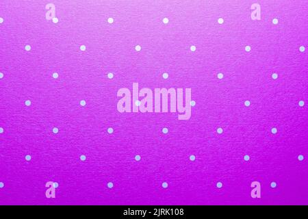 Full frame abstract texture background of solid purple and white polka dots pattern with selective focus Stock Photo