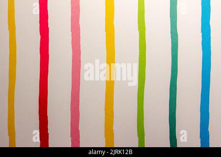 Full frame abstract texture of uneven primary color parallel striped lines on white paper background Stock Photo