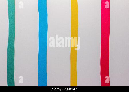 Full frame abstract texture of uneven primary color parallel striped lines on white paper background Stock Photo