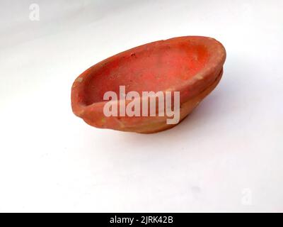 Close up of heap of Indian clay oil lanterns or diyas for Diwali festival celebration at local market stall textured backgrou Stock Photo