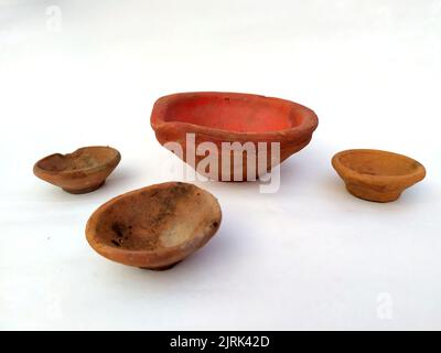 Close up of heap of Indian clay oil lanterns or diyas for Diwali festival celebration at local market stall textured backgrou Stock Photo