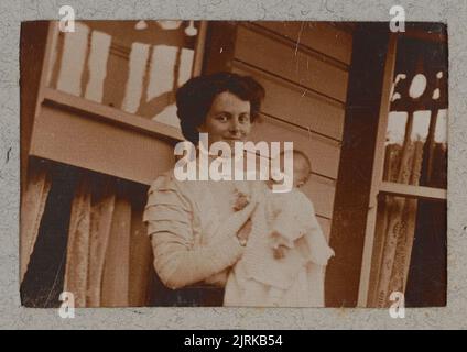 Vintage photo album page. Antique family and animals pictures from