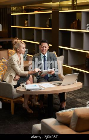 Multi-ethnic coworkers discussing ideas for new project Stock Photo
