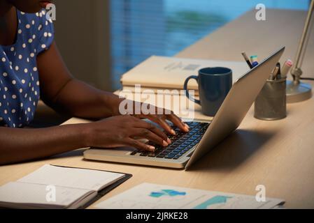 Hands of business woman working on laptop Stock Photo
