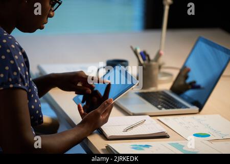 Cropped image of business woman using app on her tablet Stock Photo