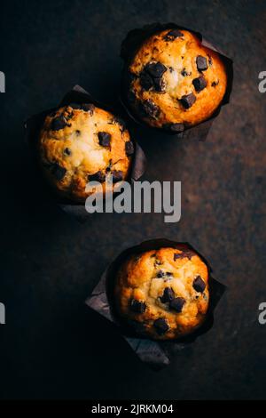Chocolate muffins on dark background Stock Photo