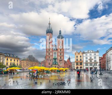 Amazing cityscape of Krakow with St. Mary's Basilica on Main Square. Popular tourist destination. Location: Krakow, Lesser Poland Voivodeship, Poland, Stock Photo