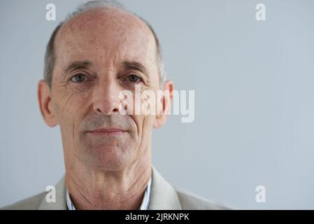 Face of senior aged man looking at camera Stock Photo