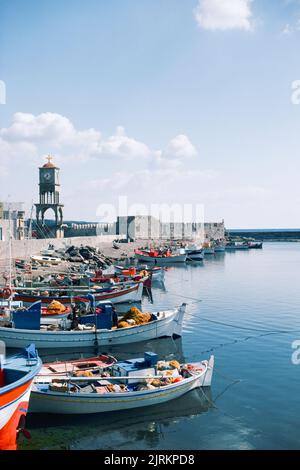 Ierapetra port in Crete, the largest and most populous of the Greek islands, the centre of Europe's first advanced civilisation. March 1980. Archival scan from a slide. Stock Photo