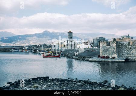 Ierapetra Venetian harbour in Crete, the largest and most populous of the Greek islands, the centre of Europe's first advanced civilisation. March 1980. Archival scan from a slide. Stock Photo