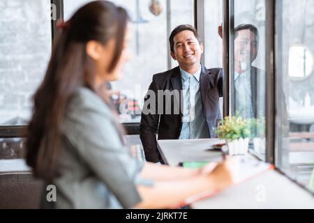 happy businessman smiling while looking at camera Stock Photo