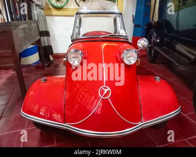 Old classic red economy Messerschmitt KR200 Kabinenroller 1959 coupe one door three wheel German micro car. Automobile Museum.  Front view. Stock Photo