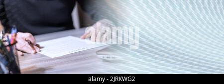 Businessman reviewing terms of contract at office; panoramic banner Stock Photo