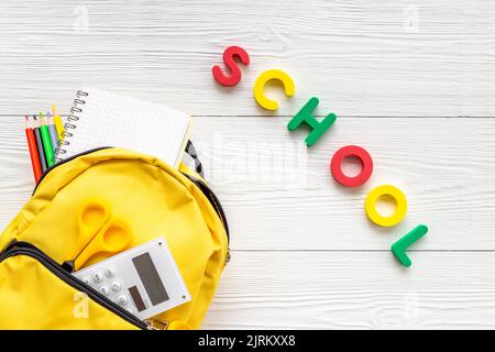 School backpack with school items and students equipment, top view Stock Photo