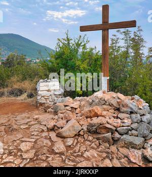 The cross hoisted on Podbrdo (apparition hill) at the place where the Blessed Virgin, on June 26, 1981, appeared to the visionary Marija Pavlolic Stock Photo