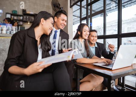 portrait of businessman and businesswoman meeting in cafe together Stock Photo