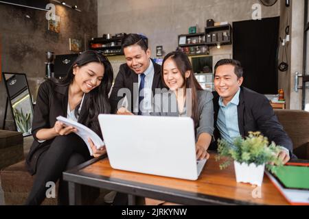 business people meeting in a cafe using laptop Stock Photo