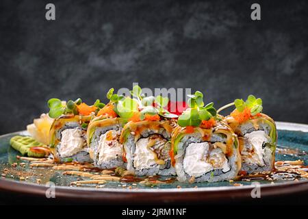 Premium Photo  Sushi set philadelphia roll california unagi black dragon  with fresh ingredients