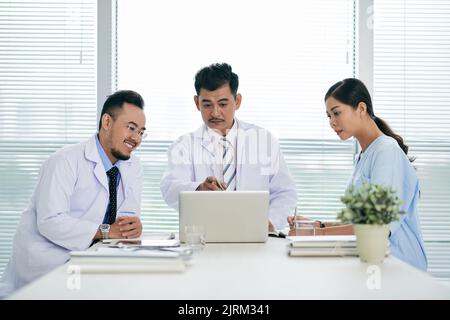 Hospital director having meeting with his coworkers Stock Photo