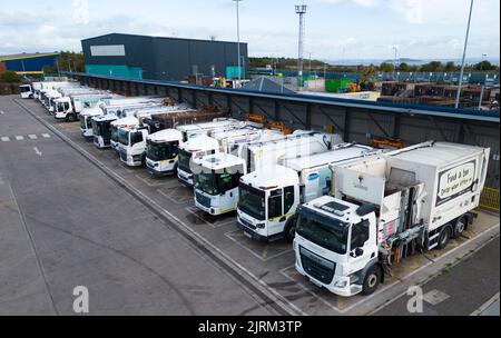 Edinburgh, Scotland, UK. 25th August 2022. Refuse collection trucks, bin lorries,  belonging to Edinburgh City Council sit parked and idle at a Refuse depot in Edinburgh. Workers in the city’s cleansing department including binmen are currently on strike over pay. Iain Masterton/Alamy Live News Stock Photo