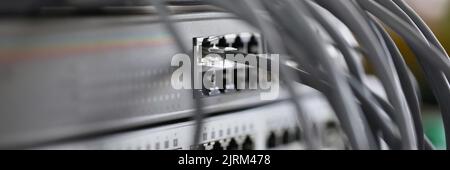 Optical mains cables connected to main server closeup Stock Photo