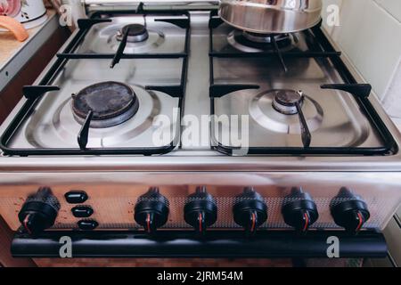 The gas stove is turned off in the kitchen in the apartment. Stock Photo