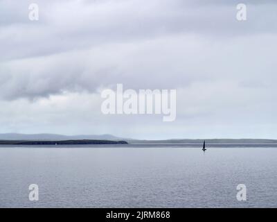 Yacht off Mull Head, Orkney, Scotland Stock Photo