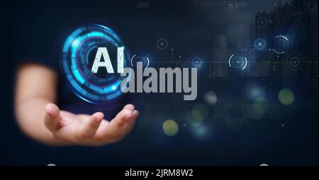 Hand of woman holding AI text with HUD network and futuristic technology concept Stock Photo