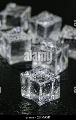 Multiple frozen ice cubes on a Black background Stock Photo