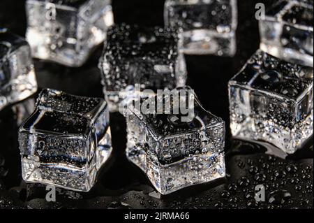 Multiple frozen ice cubes on a Black background Stock Photo