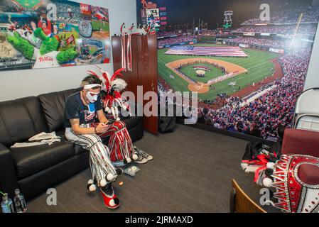 WMMR's Jacky Bam Bam waits in the dressing room for his on field performance with the Phillies Phanatic between the 5th and 6th innings of the Cincinnati Reds at Philadelphia Phillies baseball game Wednesday, August 24, 2022 at Citizens Bank Park in Philadelphia, Pennsylvania. The Phillies held Mummers Night in celebration of the group and their New Years Parade tradition. Thirty percent of Phillies ticket sales went to the Mummers clubs, who now fund the annual parade themselves after the city of Philadelphia stopped offering prize money a number of years ago. Stock Photo