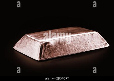 copper ore ingot, real photo, isolated black background, metallurgy industry, conductive materials, wires and cables, tin, zinc, metal alloys, brass a Stock Photo