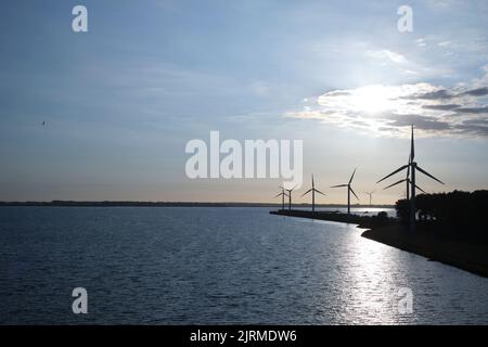 Offshore wind farm in the sundown Stock Photo