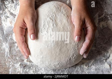 baker kneading dough Stock Photo