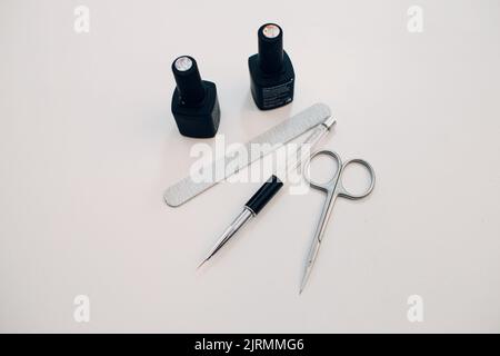 Manicure or pedicure supplies tools on table. Stock Photo