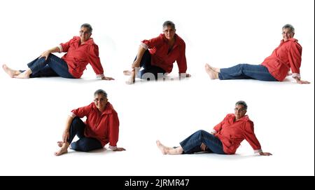 group of same woman sitting on the floor on white background Stock Photo