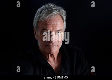 front  view portrait of senior man on black background Stock Photo
