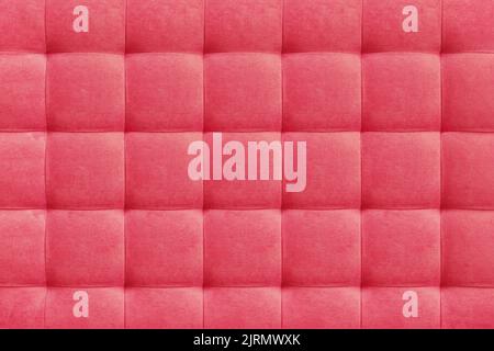 Pink suede leather background for the wall in the room. Interior design, headboards made of furniture fabric, furniture upholstery. Classic checkered Stock Photo