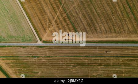 Aerial view of truck with hay bales. Agricultural machinery. Stock Photo