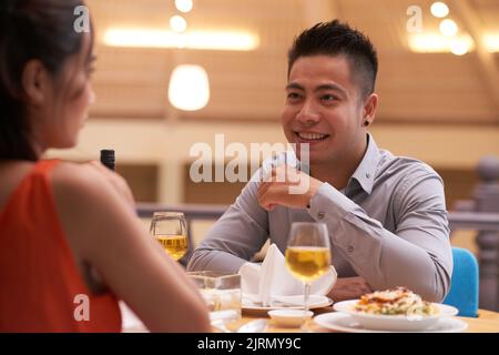 Handsome young man dining in cafe with his girlfriend Stock Photo