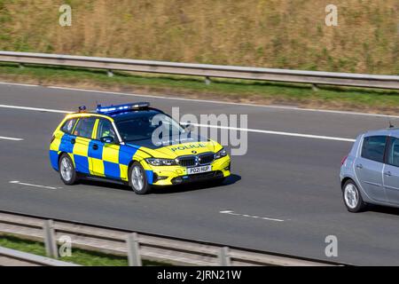 Tac ops, Lancashire Tactical Operations division. UK Police Vehicular traffic, transport, modern, BMW saloon cars flashing blue lights, traffic stop on the 3 lanes M6 motorway highway. Stock Photo