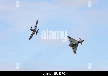 Supermarine Spitfire Mk Vb of the BBMF in formation with a Eurofighter Typhoon FGR4 from RAF Coningsby at RAF Syerston families day. Stock Photo