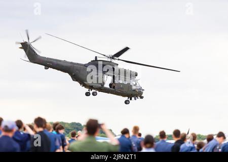 Aerospatiale Westland HC2  Puma support helicopter of the Royal Air Force departs over the crowd at RAF Syerston families day. Based at RAF Benson Stock Photo