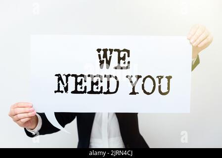 Hand writing sign We Need You. Internet Concept Company wants to recruit Employee required Cup, Pen, Notebooks, Paper Wraps And Sticky Note With Stock Photo