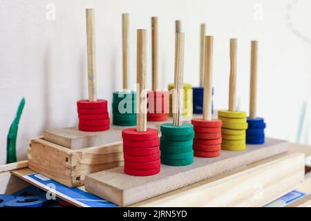 Soroban abacus in wood and colored, with the colors red, green, orange, yellow and blue, used for children's learning. Formed by a rectangular frame w Stock Photo