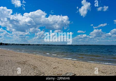 Slight breeze creates the surf at Conimicut Point Beach in Warwick, Rhode Island, on a beautiful sunny day -01 Stock Photo