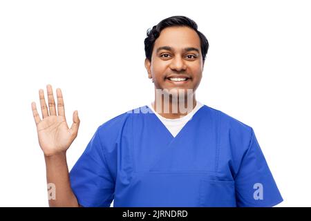 happy indian doctor or male nurse waving hand Stock Photo